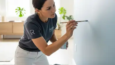 Loveland, CO painting contractor repairing scuffs, chips, and faded wall paint with color matching